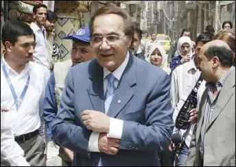  ?? BASSEM TELLAWI/AP ?? In this April 15, 2008, file photo, Egyptian actor Mahmoud Yassin, the Good Will Ambassador of the World Food Program, tours Sayyda Zeinab, one of Damascus’s suburbs, to check the conditions of Iraqi refugees in Syria.