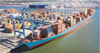  ?? JERRY JACKSON/BALTIMORE SUN ?? An expanded berth at the Port of Baltimore will allow more access to ships like the Gunde Maersk, which has a capacity to handle 11,000 twenty-foot equivalent (TEU) containers.