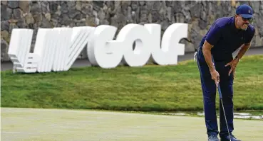  ?? ASSOCIATED PRESS ?? Phil Mickelson lines up a shot on the 18th hole during the first round of the Bedminster Invitation­al LIV Golf tournament in Bedminster, New Jersey, last July. Players who defected from the PGA Tour to join Saudi-funded LIV Golf are still welcome at the Masters next year, even as Augusta National officials expressed disappoint­ment recently in the division it has caused in golf.