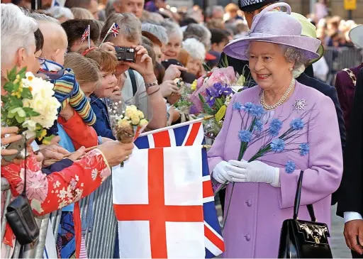  ?? Pictures: Paul Nicholls ?? Her Majesty the Queen meeting members of the public in Gloucester in 2003