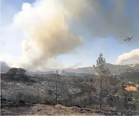  ??  ?? In this August 1 photo, smoke from multiple wildfires billows into the sky in Scotts Valley near Lakeport, California.