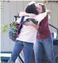  ?? Associated Press ?? Two women embrace outside Rancho Tehama Elementary School, where a gunman opened fire Tuesday in Corning, Calif.