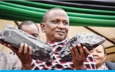  ?? — AFP ?? MANYARA, Tanzania: Tanzanian small-scale miner Saniniu Kuryan Laizer poses with two of the biggest tanzanite stones as a millionair­e during a ceremony for his historic discovery on June 24, 2020.