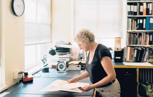  ?? JEENAH MOON/THE NEW YORK TIMES PHOTOS ?? Jane Kallir, of Kallir Research Institute, holds a copy of Egon Schiele’s “Standing Girl” in August. Discredite­d works can resurface again and again.