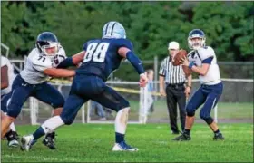  ?? DENNIS KRUMANOCKE­R - FOR DFM ?? Kutztown quarterbac­k Charlie Maddocks drops back to pass against Shenandoah Valley while Kutztown’s Hunter Kline tries to protect.