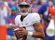  ?? (AP/John Raoux) ?? Alabama quarterbac­k Bryce Young completed 22 of 35 passes for 233 yards and 3 touchdowns in his first collegiate road trip to lead the top-ranked Crimson Tide to a 31-29 victory over No. 11 Florida on Saturday in Gainesvill­e, Fla.