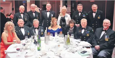  ?? ?? Bob Seward (front row, third from left) president of the ONE Cork City Branch, who were awarded a Pride of Cork award 2024 for the positive work they do for veterans.