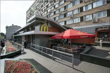  ?? FILE — THE ASSOCIATED PRESS ?? The oldest of Moscow’s McDonald’s outlets, which was opened on Jan. 31, 1990, is closed on Aug. 21, 2014. McDonald’s says it’s started the process of selling its Russian business, which includes 850restaur­ants that employ 62,000people. The fast food giant pointed to the humanitari­an crisis caused by the war, saying holding on to its business in Russia “is no longer tenable, nor is it consistent with McDonald’s values.” The Chicago-based company had temporaril­y closed its stores in Russia but was still paying employees.