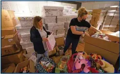  ?? ?? Jackie Crawford, left, has seen thousands of people around the country flock to donate preloved boxes to be fill with items