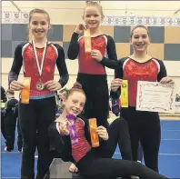  ?? SUBMITTED PHOTO ?? Members of the Summerside Saultos Gymnastics Club pose for a photo at the Aerials invitation­al gymnastics meet in Amherst, N.S., recently. Payton Maund is in front while in the back, from left, are Alexa McCarthy, Lucy Miller and Deirdre Studer.