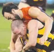  ?? Pictures: MICHAEL KLEIN, QUINN ROONEY ?? BEST OF ENEMIES: There was no love lost between former Hawk Jordan Lewis and a couple of old teammates last night, including Isaac Smith (main) and Jarryd Roughead (above). Even Tom Mitchell weighed in (below).