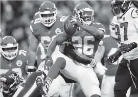  ?? JEFF ROBERSON AP ?? Chiefs running back Damien Williams scores a touchdown past Texans safety Justin Reid during the second half of an NFL divisional playoff football game in Kansas City, Mo.