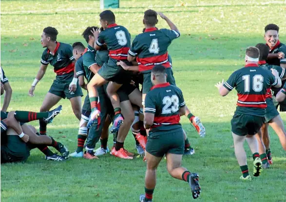  ?? SUPPLIED ?? Dilworth’s First XV celebrate a historic 20-15 win over high school rugby powerhouse Mount Albert Grammar.