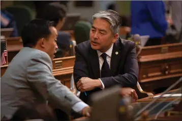  ?? PHOTO BY ANNE WERNIKOFF FOR CALMATTERS ?? Assembly members Davis Chiu, left, and Al Muratsuchi speak during the floor session on August 12, 2019.