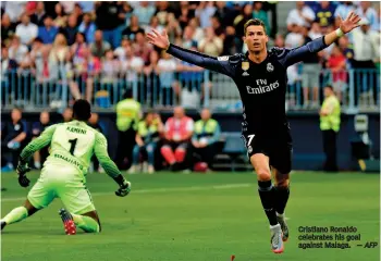  ?? AFP ?? Cristiano Ronaldo celebrates his goal against Malaga.