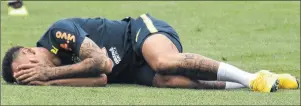  ?? AP PHOTO ?? Brazil’s Neymar lays on the pitch during a training session Wednesday in Sochi, Russia.