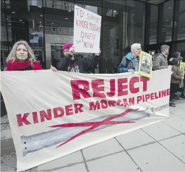  ?? JONATHAN HAYWARD/THE CANADIAN PRESS ?? Shares of Kinder Morgan, a target of anti-pipeline activists, had a rough ride Tuesday as they began trading on the TSX. Investors were deterred by political uncertaint­y in B.C. as well as the company’s plan to use IPO proceeds to pay down its U.S. debt.