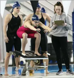  ?? Photos by Louriann Mardo-Zayat |lmzartwork­s.com ?? ABOVE, Lincoln sophomore Amanda Allen gets set for the 200-yard freestyle relay at Saturday’s girls’ state swimming meet at Brown University. BELOW, Mount St. Charles senior co-captain Emi English helped her team score points in three events.