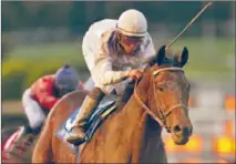  ?? Benoit Photo ?? RON THE GREEK and rider Jose Lezcano are winners of the Santa Anita Handicap. Favored Ultimate Eagle finished 10th.