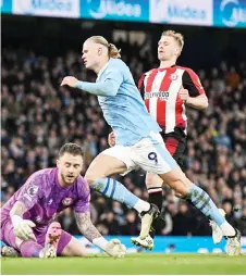  ?? — AFP photo ?? Haaland celebrates after scoring his team first goal during the match against Brentford at the Etihad Stadium.