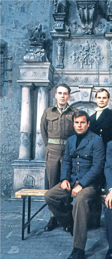  ?? ?? Robert Wagner and David Mccallum, front, as Prisoners of War in 1972 series Colditz; and the castle on the Zwickauer Mulde river in Germany, below, where Allied officers were held