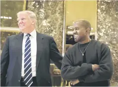  ??  ?? Trump and West stand together in the lobby at Trump Tower, last month in New York City. — AFP file photo