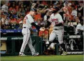  ?? DAVID J. PHILLIP – THE ASSOCIATED PRESS ?? The Orioles' Austin Hays, right, is congratula­ted by third base coach Tony Mansolino after homering in the seventh.