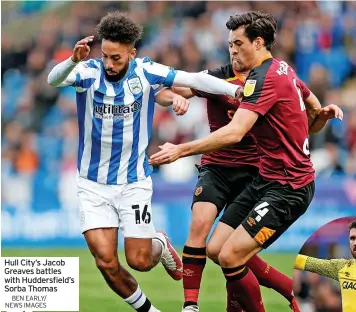  ?? BEN EARLY/ NEWS IMAGES ?? Hull City’s Jacob Greaves battles with Huddersfie­ld’s Sorba Thomas