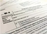  ?? AP PHOTO/PATRICK SISON ?? The IRS has introduced a new Form W-4 that must be used by all employers in 2020 to better accommodat­e recent changes to the tax law.