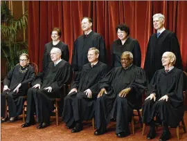  ?? OLIVIER DOULIERY / ABACA PRESS 2017 ?? Voting 5-4 to uphold President Donald Trump’s travel ban were Chief Justice John Roberts (front row, center) and Associate Justices Anthony Kennedy (front, second from left), Clarence Thomas (front, fourth from left), Samuel Alito (rear, second from left) and Neil Gorsuch (rear, far right). Voting against were Associate Justices Ruth Bader Ginsburg (front row, left), Stephen Breyer (front row, far right), Elena Kagan (rear, left) and Sonia Sotomayor (rear, third from left).