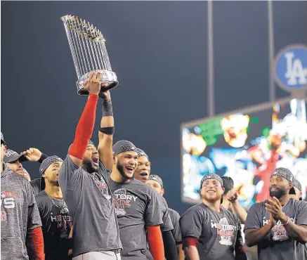  ?? JAE C. HONG/ASSOCIATED PRESS ?? The Boston Red Sox celebrate after Game 5 of baseball’s World Series against the Los Angeles Dodgers on Sunday in Los Angeles. The Red Sox won 5-1 and finished 7-1 on the road in these playoffs against the Yankees, Houston and L.A.