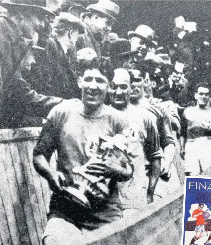  ??  ?? > April 23, 1927: Cardiff captain Fred Keenor holds the cup following the Bluebirds’ historic victory