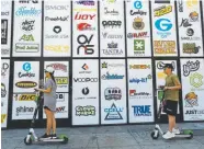  ?? Richard Vogel, The Associated Press ?? Advertisin­g logos for different cannabis brands are posted on the side of a shop on a street lined with wholesale cannabis vape shops in downtown Los Angeles.