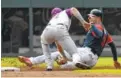  ?? THE ASSOCIATED PRESS ?? The Atlanta Braves’ Freddie Freeman, right, is caught stealing second base by Colorado’s Trevor Story on Sunday in Atlanta.