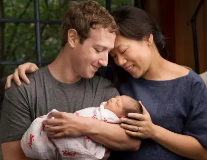  ??  ?? NAME GAME: Max Chan Zuckerberg is held by her parents, Mark Zuckerberg and Priscilla Chan Zuckerberg