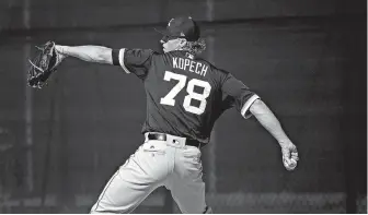  ?? Associated Press ?? Chicago White Sox pitcher Michael Kopech of Mount Pleasant, Texas, throws a pitch at the White Sox spring training facility Feb. 15 in Glendale, Ariz.