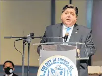  ?? JON LANGHAM/THE BEACON-NEWS ?? Gov. J.B. Pritzker discusses equity regarding the rollout of COVID-19 vaccinatio­ns on Tuesday in Aurora.