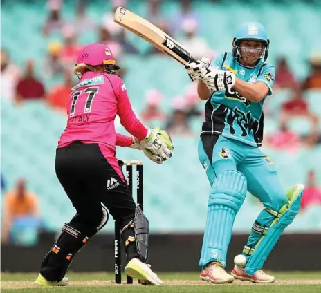  ?? Photo: BRENDON THORNE ?? MILESTONE KNOCK: Delissa Kimmince wields the bat during the Brisbane Heat’s match against the Sydney Sixers. The all-rounder, along with two teammates, brought up their 50th games for the Heat.