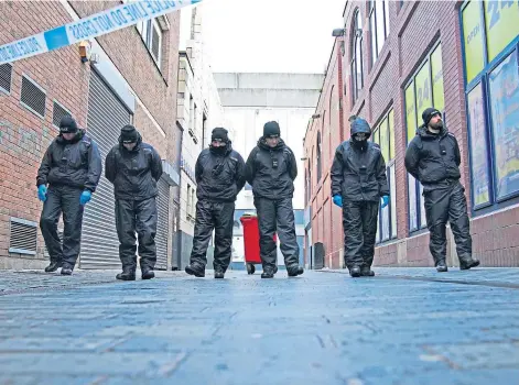  ?? ?? SEARCH: Police near the scene in Liverpool city centre where 12-year-old Ava White was stabbed to death.