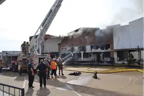  ?? Photo by Kate Stow ?? ■ The Allday’s Department Store building was deemed a total loss after a fire swept through three downtown businesses Thursday in Atlanta, Texas.