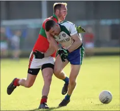  ??  ?? Rathnew’s James Stafford and AGB’s Stephen Hurley collide.