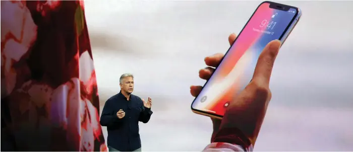  ?? AP ?? Phil Schiller, Apple's senior vice president of worldwide marketing, discuss the Iphone X's features at its unveiling in September