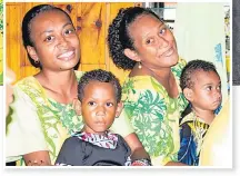  ?? Picture: FIJI GOVERNMENT ?? Qarasarau Village women’s club members and their children witness the occasion.