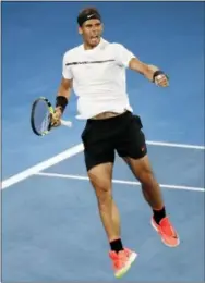  ?? DITA ALANGKARA — THE ASSOCIATED PRESS ?? Rafael Nadal celebrates a point win against France’s Gael Monfils during their fourth round match at the Australian Open Monday in Melbourne.