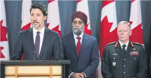  ?? DAVE CHAN AFP VIA GETTY IMAGES ?? Prime Minister Justin Trudeau, with Defence Minister Harjit Sajjan and Chief of Defence Staff Gen. Jonathan Vance behind him, called on Iran to allow Canada to help investigat­e the crash.