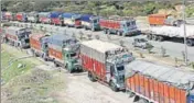  ?? NITIN KANOTRA/HT ?? Stranded trucks on the highway following landslides at different places in Jammu on Tuesday.