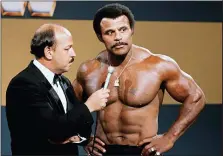  ?? WWE, INC. VIA AP ?? In this undated photo provided by WWE, Inc., “Mean” Gene Okerlund interviews Rocky “Soul Man” Johnson. Johnson, a WWE Hall of Fame wrestler who became better known as the father of actor Dwayne “The Rock” Johnson, died Wednesday, Jan. 15, 2020. He was 75.