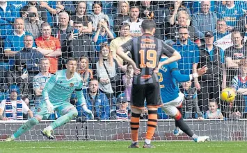  ?? ?? James Tavernier’s penalty beats United keeper Benjamin Siegrist to open the scoring.