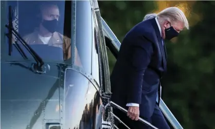  ??  ?? President Trump arriving at Walter Reed military hospital by helicopter. Photograph: Oliver Contreras/EPA