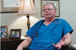  ??  ?? CLAXTON, Georgia: Dr Kyle Parks sits in his office outside Evans Memorial Hospital in Claxton. —AP